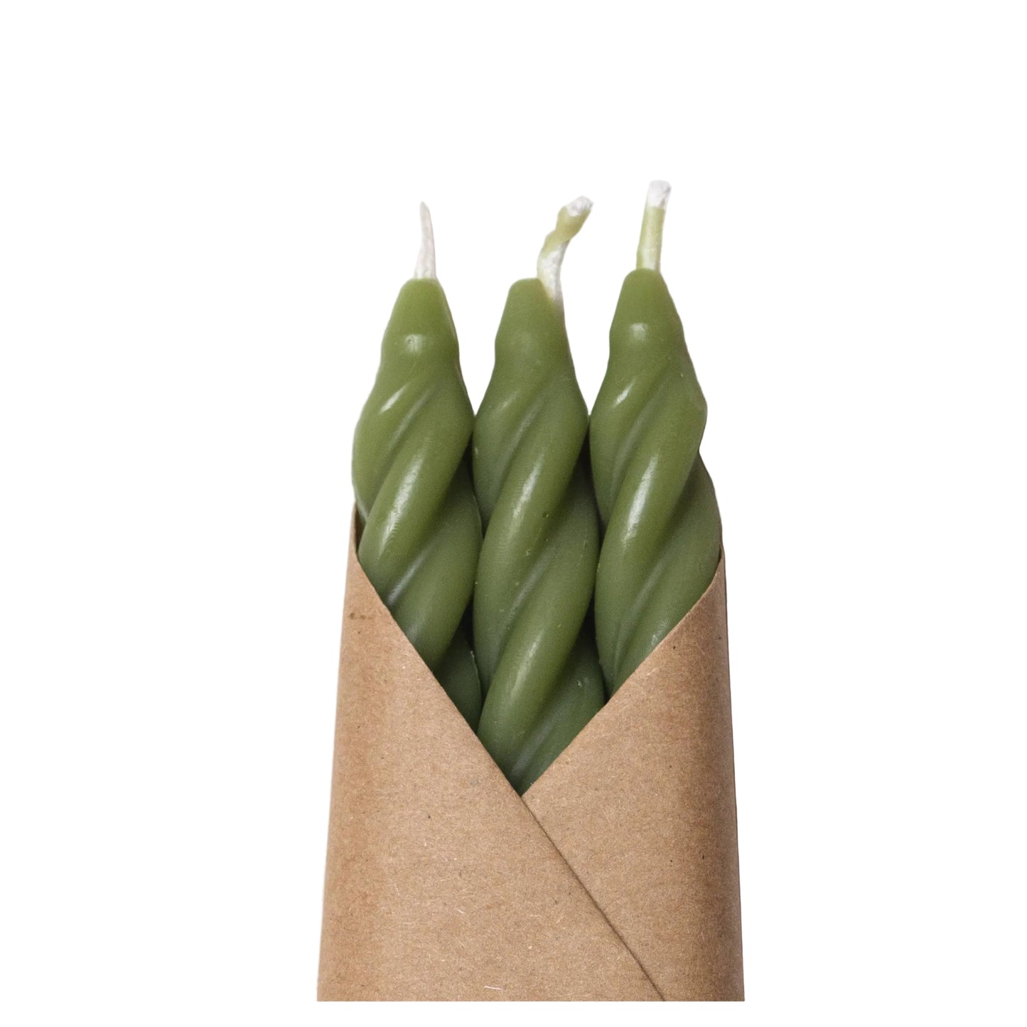 Three green twisted candles in a brown paper sleeve on a white background