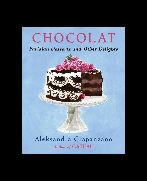 Book cover for 'CHOCOLAT: Parisian Desserts and Other Delights' by Aleksandra Crapanzano, featuring an illustration of a chocolate cake on a pedestal against a light blue background.