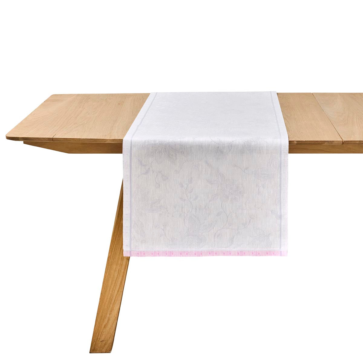 White table runner on a wooden table with a white background