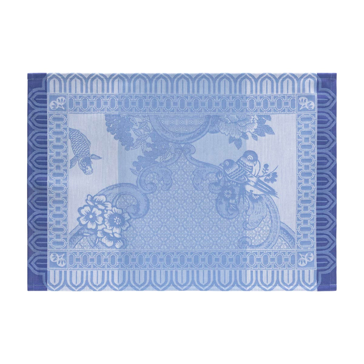 Decorative blue placemat with floral and paisley patterns on a white background