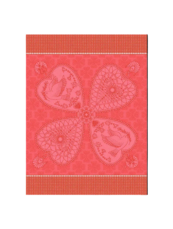 A square decorative textile or wallpaper design in coral pink and red, featuring a large four-petal floral motif with birds and floral details, bordered by patterned bands at the top and bottom.