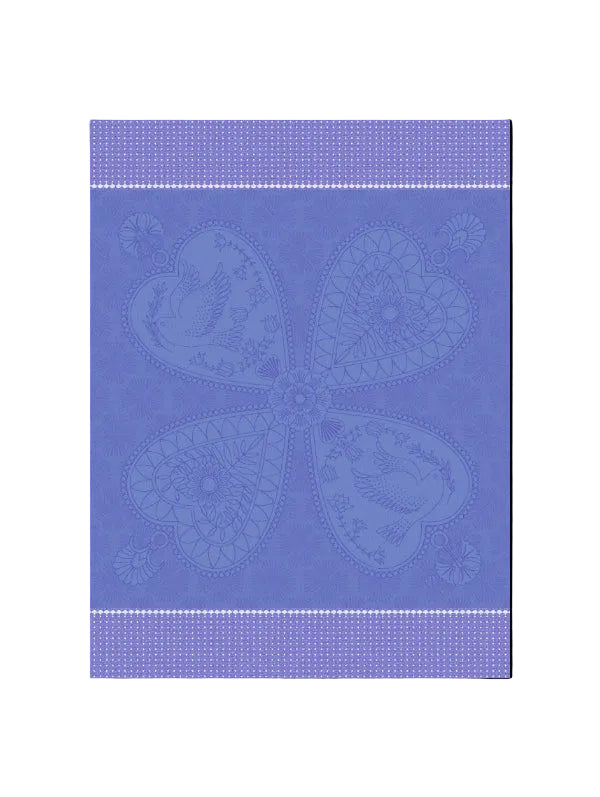 A square fabric or textile swatch in periwinkle blue with a tonal, raised floral pattern. The design features a central quatrefoil motif composed of four heart-shaped sections with birds and floral details, framed by horizontal dotted borders at the top and bottom.
