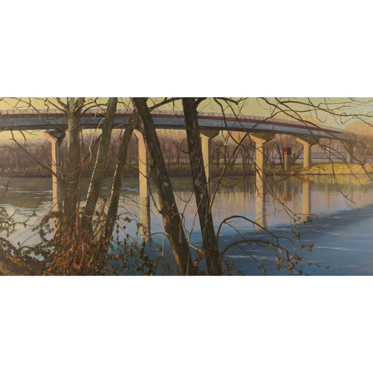 Bridge over a river with trees in the foreground