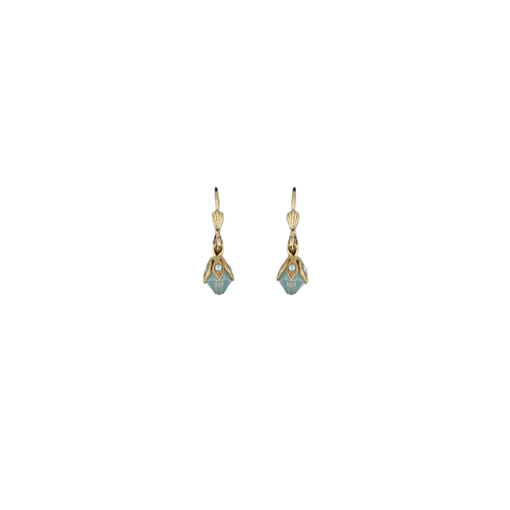 Pair of gold earrings with gemstones on a light gray background