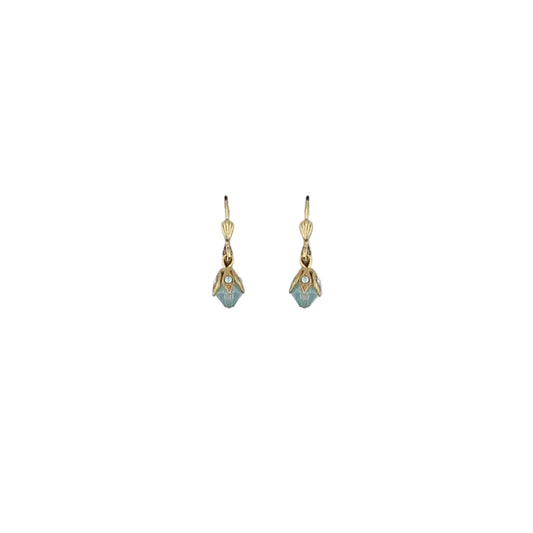 Pair of gold earrings with gemstones on a light gray background