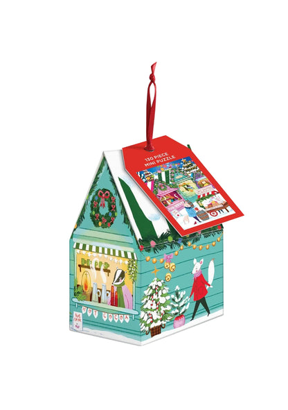Christmas-themed mini puzzle in a decorative box with a red pull tab on a white background