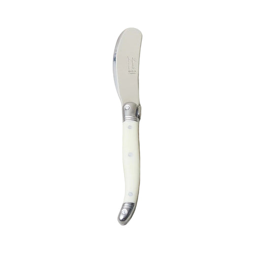 Butter knife with decorative handle on a light beige background
