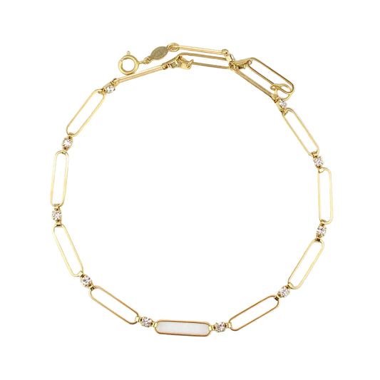 Gold bracelet with paperclip links on a light gray background