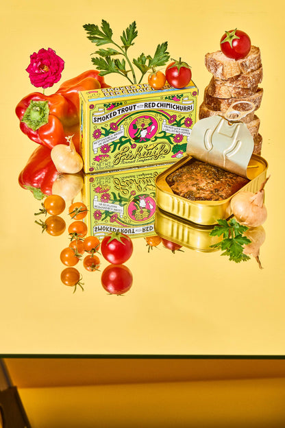 Canned food with packaging and fresh ingredients on a yellow background