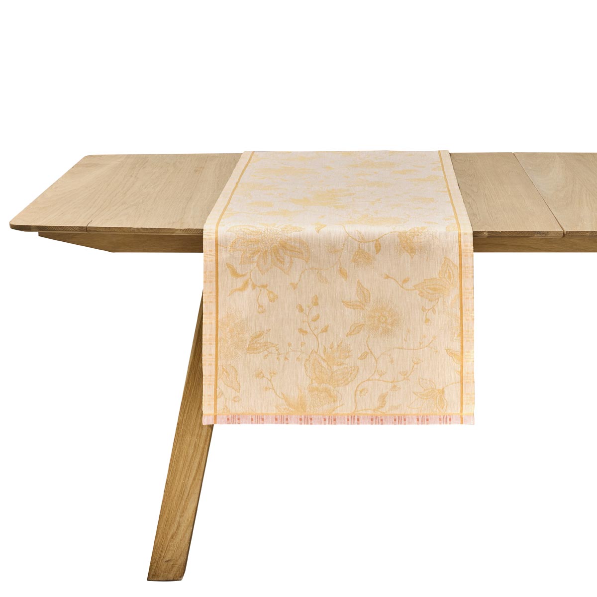 Wooden table with a decorative beige runner on a white background