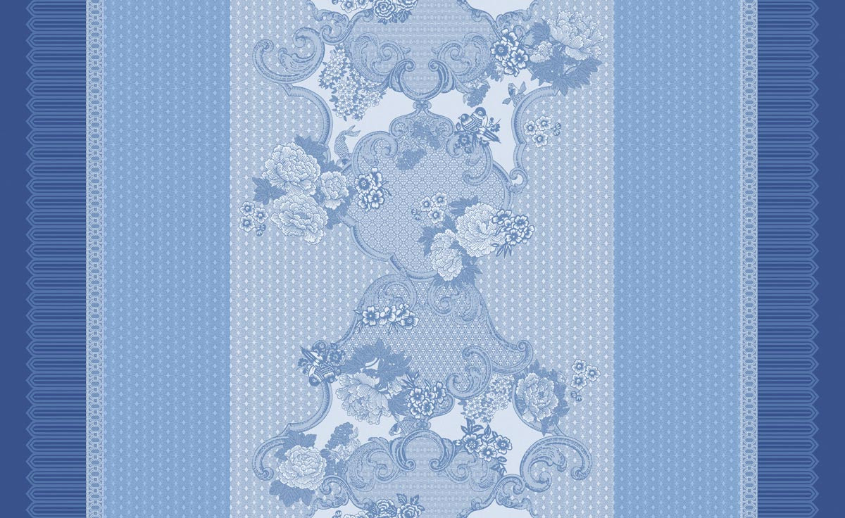 Decorative blue coated  fabric pattern with floral and swirl designs on a blue background