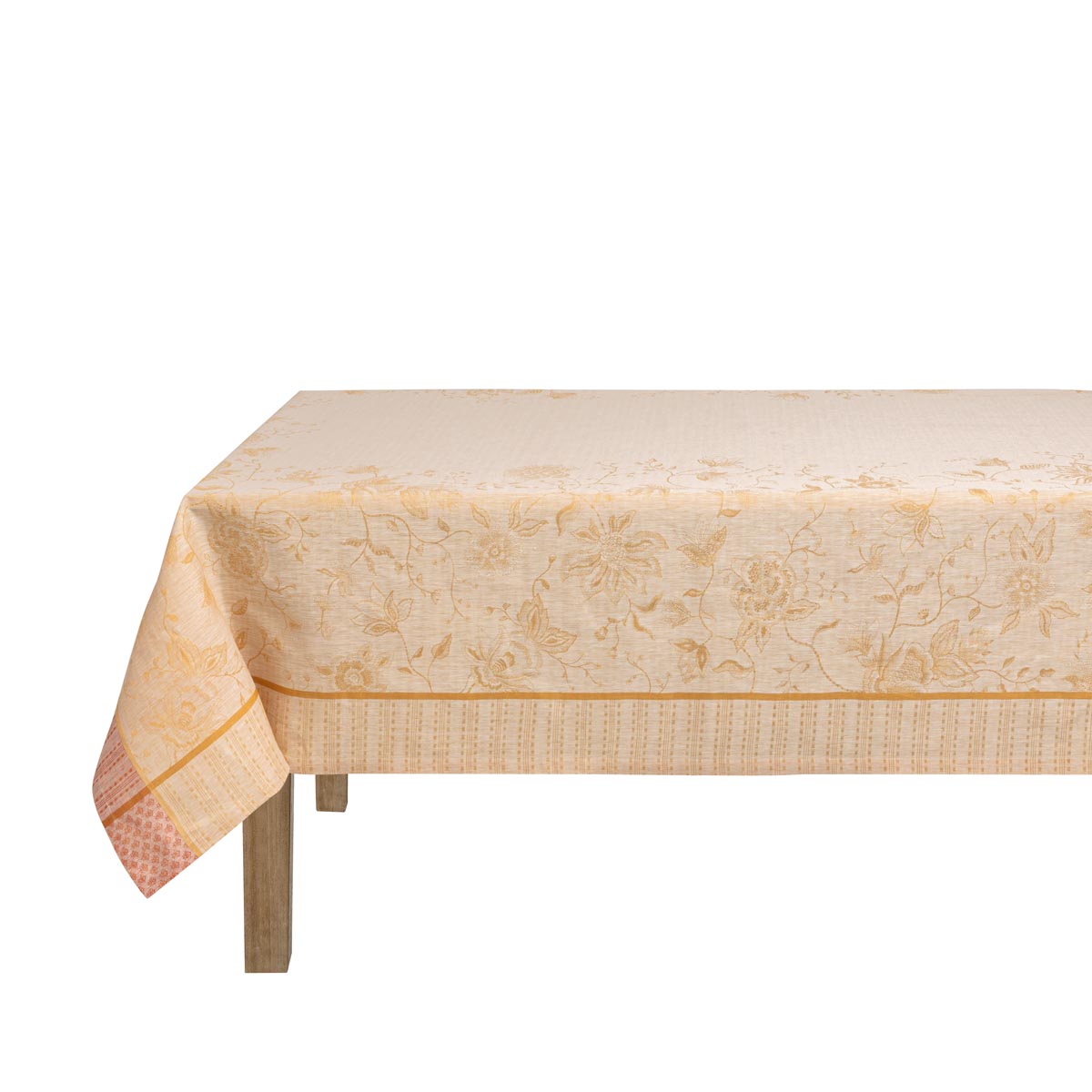 Beige patterned tablecloth on a wooden table with a white background