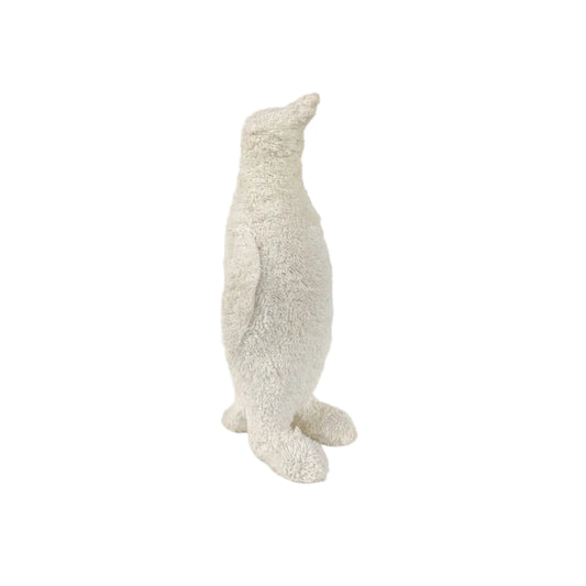 A plush penguin toy in a textured off-white or cream bouclé fabric, standing upright against a plain white studio background.