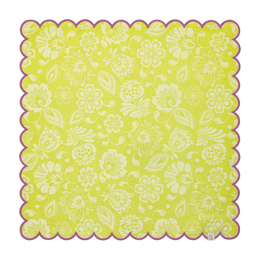 Floral patterned fabric square with scalloped edge on a white background
