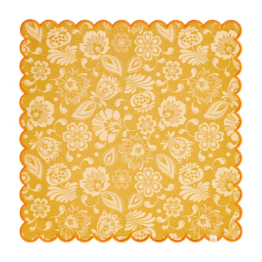 Decorative yellow paper with floral pattern on a white background