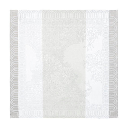 White quilt with geometric gray border on a white background