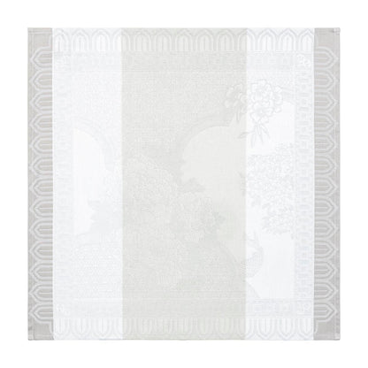 White quilt with geometric gray border on a white background
