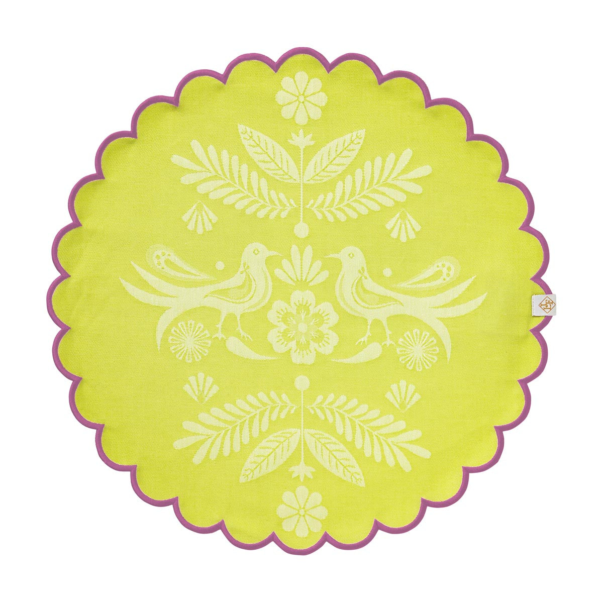 Round green placemat with white floral and bird design on a white background