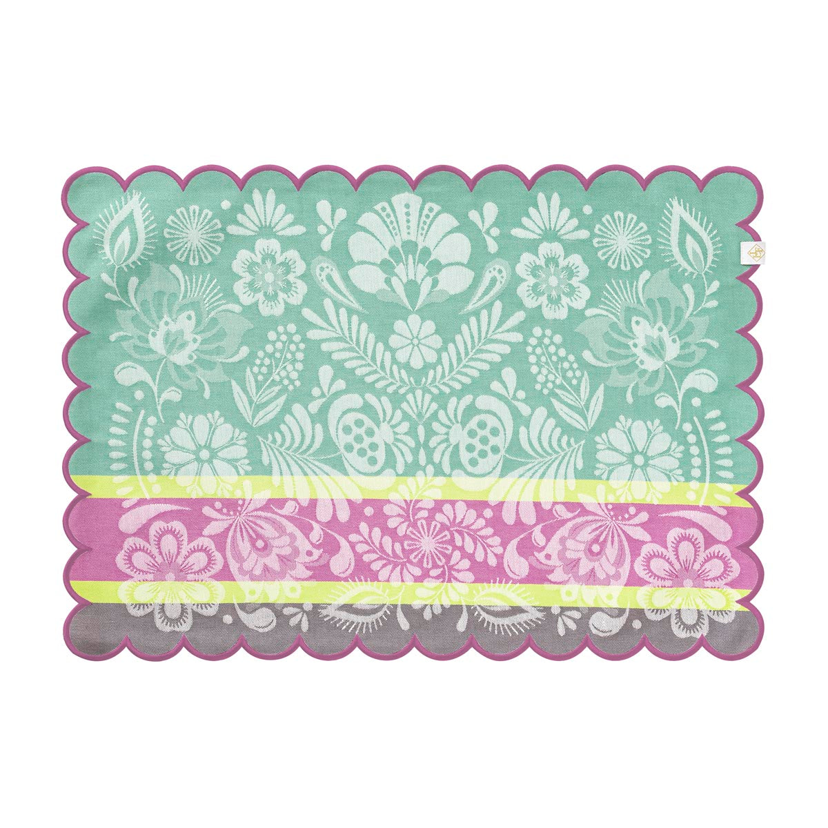 Floral patterned placemat with scalloped edge on a white background