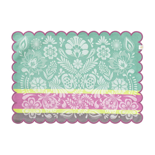 Floral patterned placemat with scalloped edge on a white background