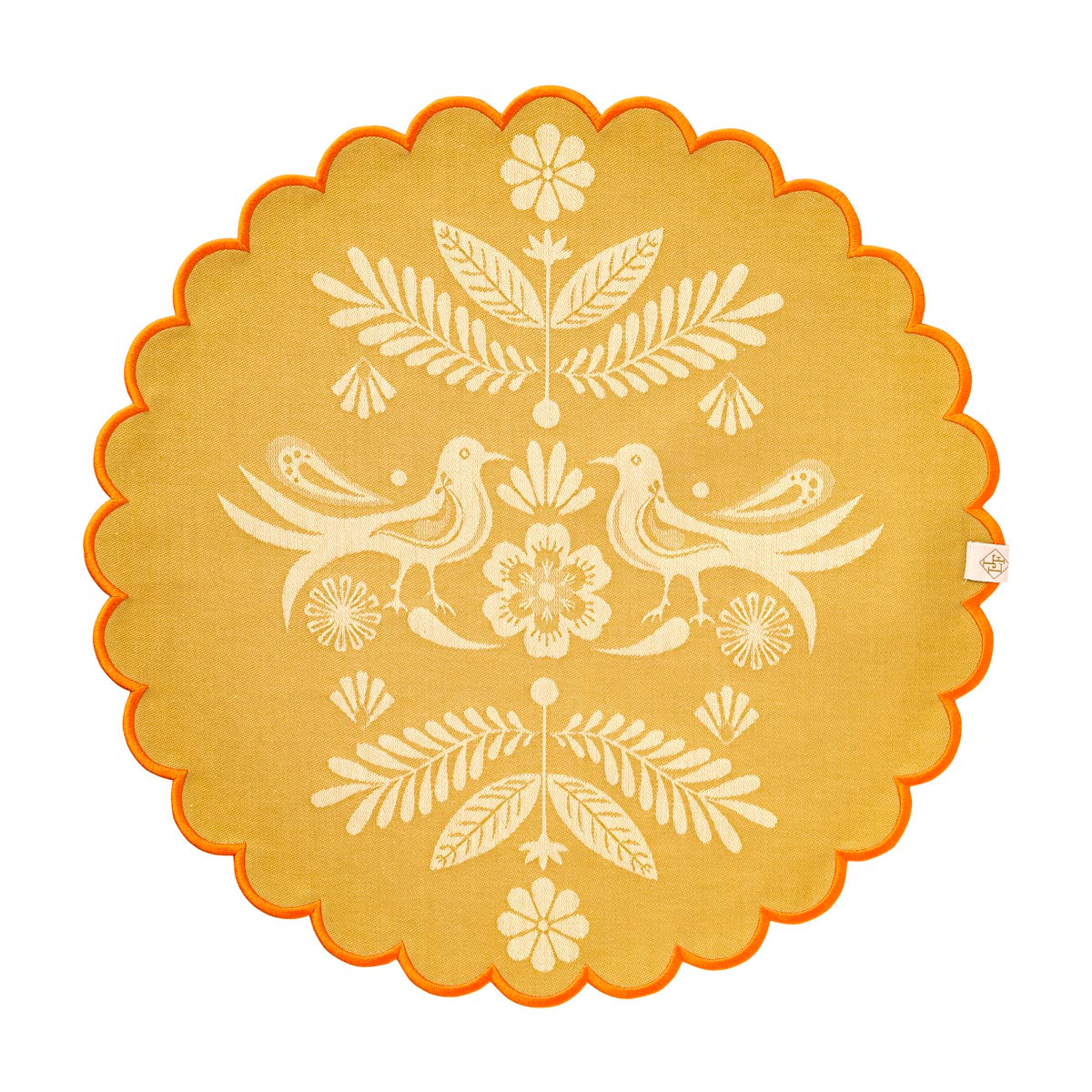 Decorative round mat with floral and bird pattern on a beige background