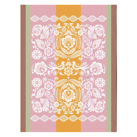 Decorative book cover with floral and paisley patterns on a pink and brown background