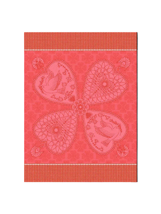 A square decorative textile or wallpaper design in coral pink and red, featuring a large four-petal floral motif with birds and floral details, bordered by patterned bands at the top and bottom.