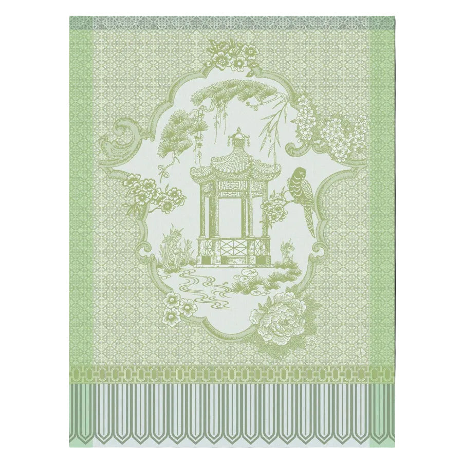 Decorative design with a pagoda and floral elements on a green background