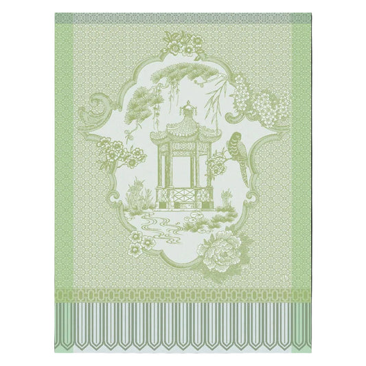 Decorative design with a pagoda and floral elements on a green background