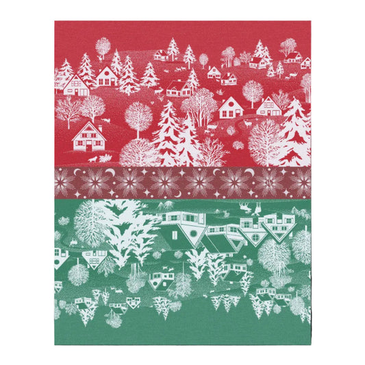 A close-up of a patterned fabric or paper design split into two horizontal sections: the top is red with white winter village motifs including houses, trees, and snowflakes, and the bottom is green with the same white pattern.